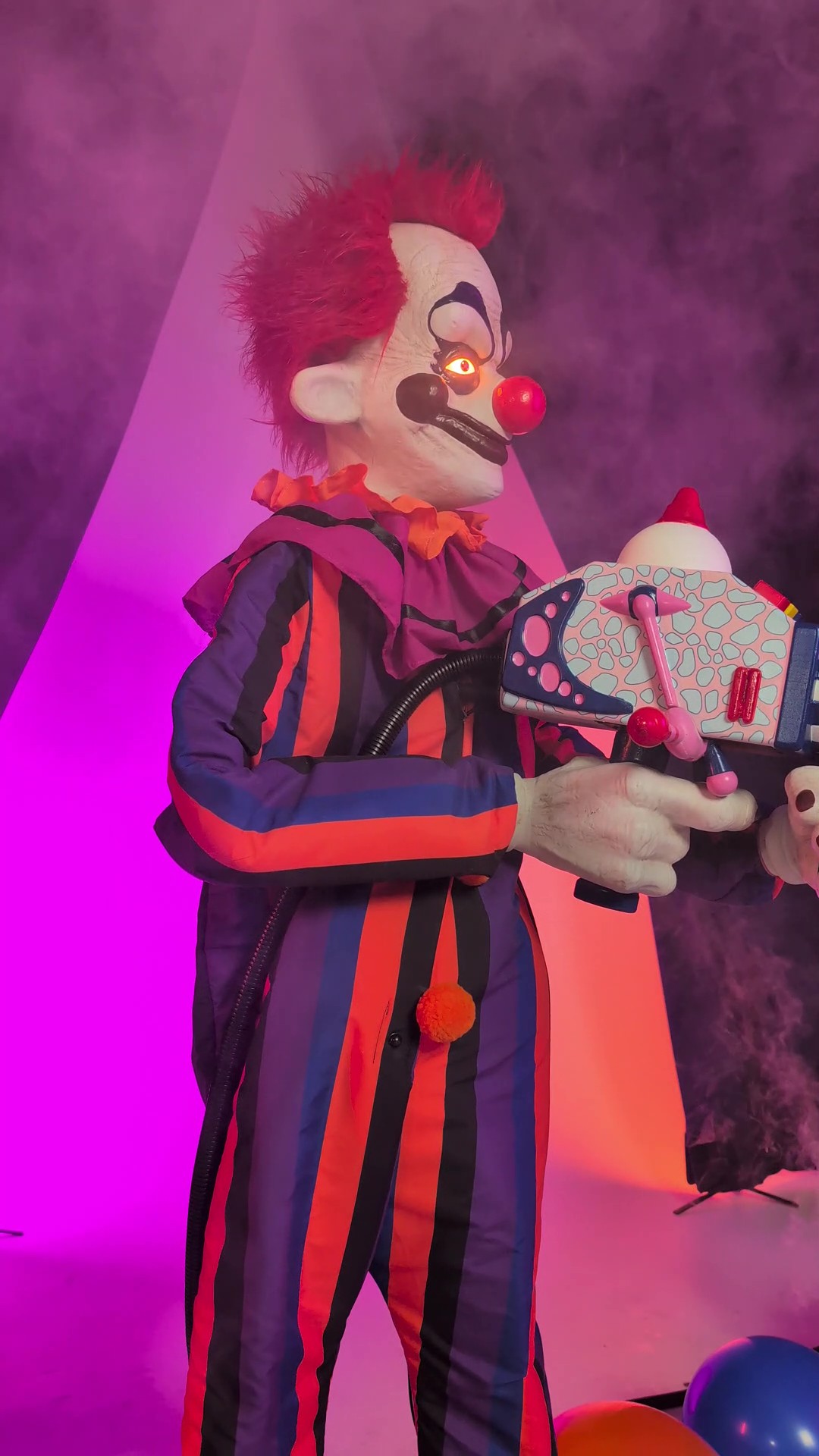 Straight from the big top of terror, this exclusive 5.6FT Rudy Killer Klowns from Outer Space Animated Decoration delivers out-of-this-world scares! Lights, motion, and eerie audio make him a standout in any Halloween setup.